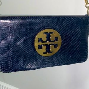 - Tory Burch Audra Reva Python Clutch in Dark Navy.